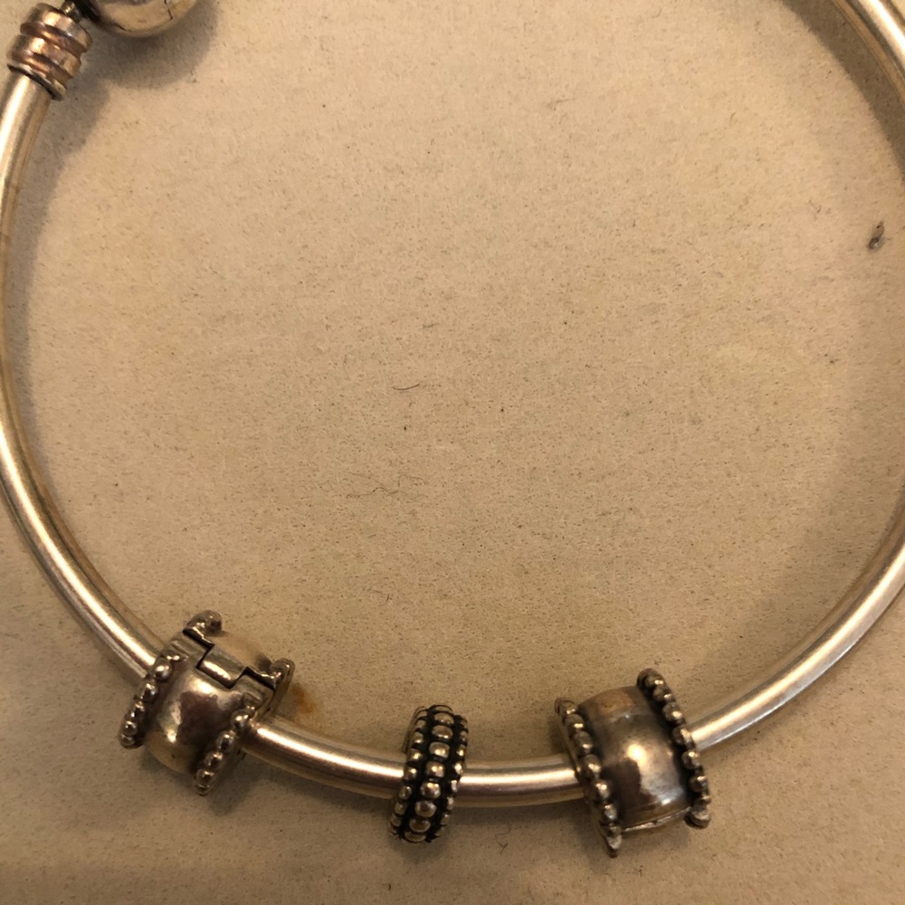 Pandora sterling bangle with clips and spacer.